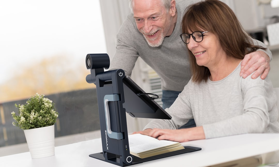 72-year-old using Snow Pad to read a recipe book - hands-free low vision aid